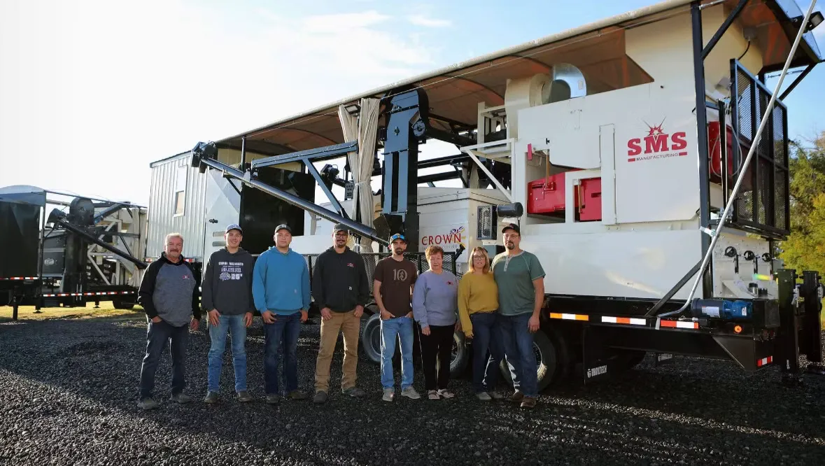 The SMS Manufacturing crew standing in front of a finished mobile grain cleaner